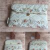 Pochette à livre de poche écoresponsable Modèle 7 matelassée écru et beige, motif marin coquillages avec bouton doré.