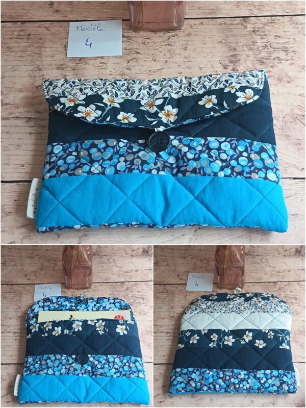 Pochette à livre de poche Modèle 4 au design épuré, combinant un tissu matelassé bleu canard et un motif de fleurs blanches délicates.